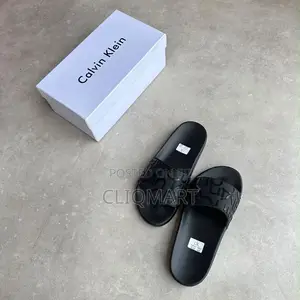 Calvin Klein Embossed Monogram Slider Sandals