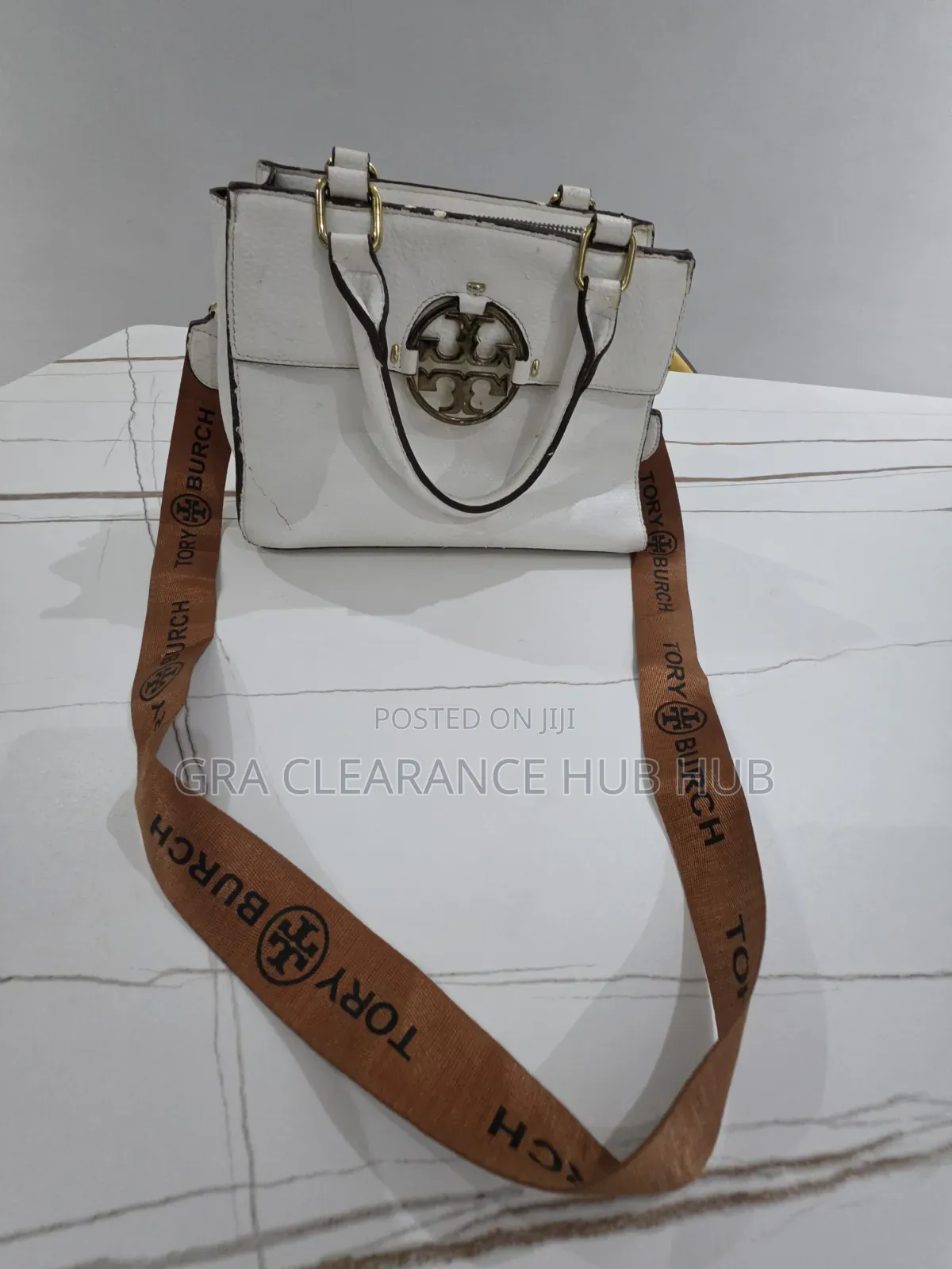 White Pebbled Top Handle Satchel With Branded Web Strap