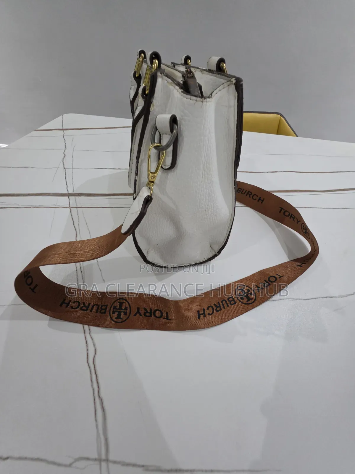 White Pebbled Top Handle Satchel With Branded Web Strap