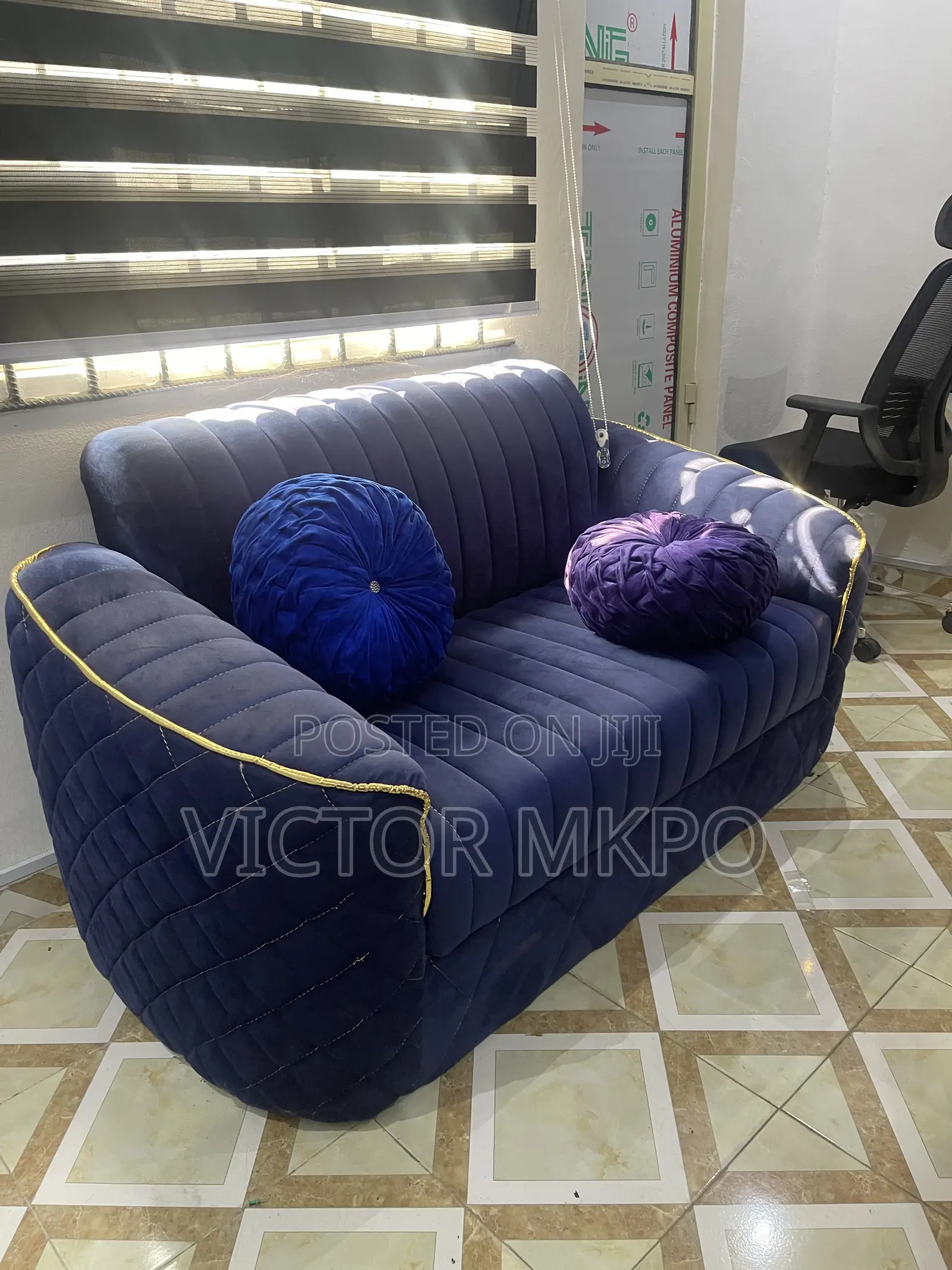 Medium Sized Sofa With 2 Throw Pillows