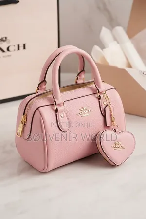 Luxury Pink Handbag With Heart-Shaped Charm