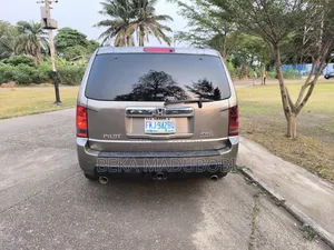 Honda Pilot EX-L 4dr SUV 4WD (3.5L 6cyl 5A) 2009 Gold