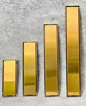 Gold Colour Tiles Inside Floor Drain