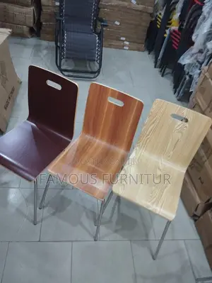 Curved Wooden Seat Shells and Slender Steel or Iron Legs.