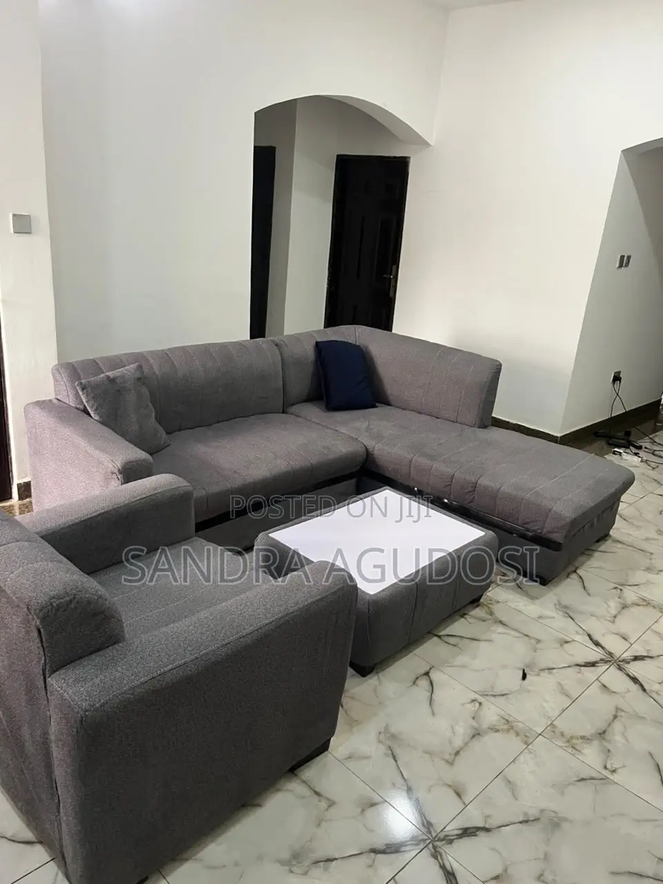 L-Shaped Sofa With Single Chair and Center Table