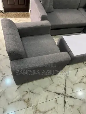 L-Shaped Sofa With Single Chair and Center Table