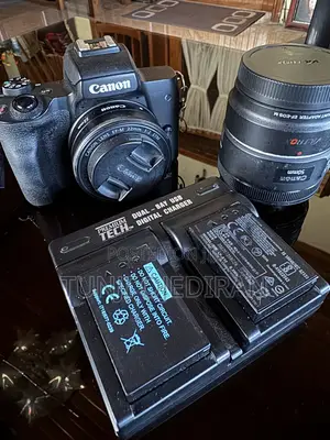 Canon M50 With 2 Prime Lenses, 1 Adapter, 2 Batteries & Charger