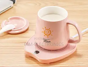 Mug With Warmer and a Spoon.