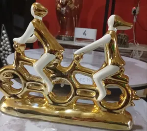 White and Gold Bike Figurine