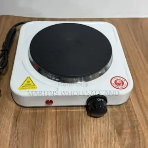 Portable Single-Burner Electric Hot Plate Resting on a Polished Wooden