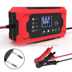 Red Portable Car Jump Starter Power Bank With Jumper Cables Attached