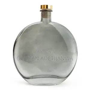 Scented Reed Diffuser Labeled Bergamot & Oud With a Gold-T