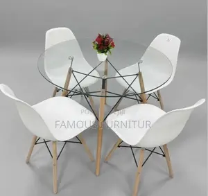 Round Glass-Top Dining Set With Four Eames-Style