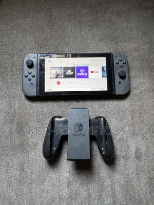 Nintendo Switch With Two Game Cartridge FIFA 21 and Assassins Creed