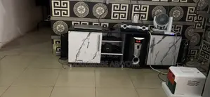 Very Clean and Neatly Used TV Console/Shelve Up for Sale.