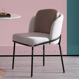 Modern Upholstered Dining Chair With a Curved Barrel Back, Contrasting