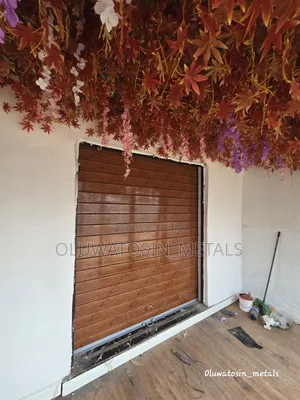 Premium Galvanized Roller Shutter Door – Wood Colour Design
