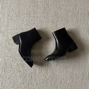 The Heeled Leather Ankle Boot in Black