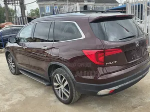 Honda Pilot Touring 4dr SUV 4WD (3.5L 6cyl 9A) 2017 Burgundy