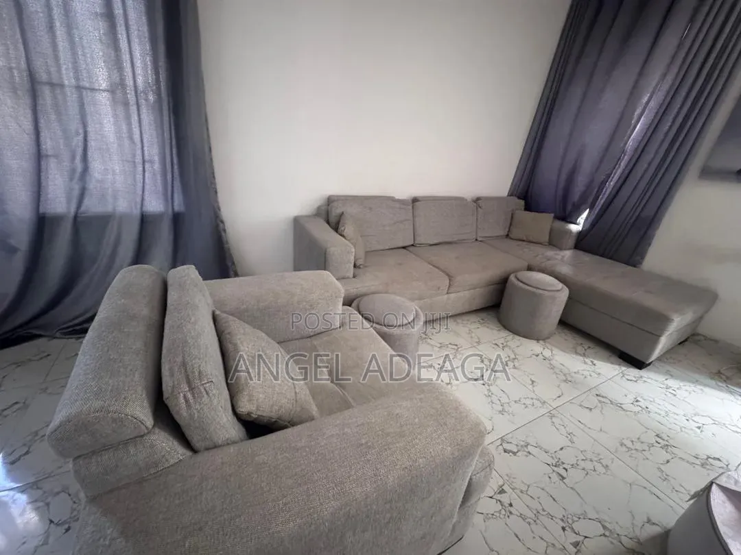 7 Sitting L Shaped Sofa and Ottomans