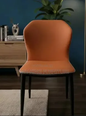 Modern Orange Leather Wingback Dining Chair With a High Backrest