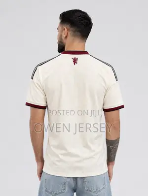 Manchester United Cream Jersey – Burgundy Edition.