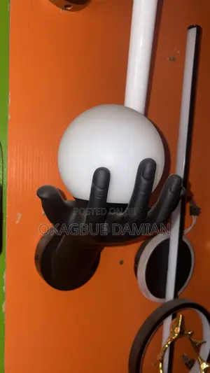 Hand-Shaped Wall Sconce With Globe Bulb