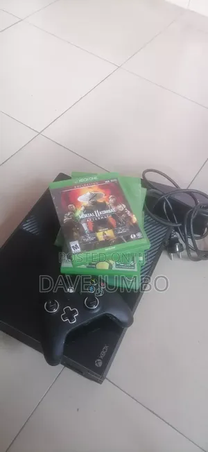 Xbox One and Wired Controller + 6 Discs and 15 Digital Games for Sale