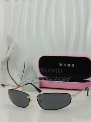 Miu Miu Rimless Cat-Eye Sunglasses With Gold Accents.