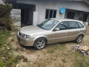 Mazda 323 2006 Gold