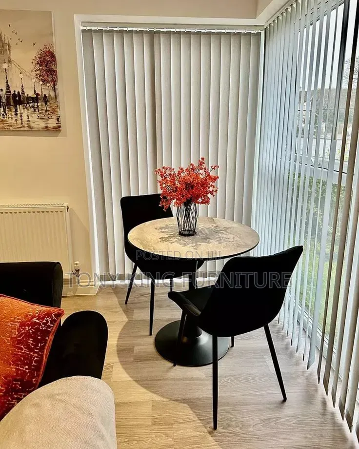 Round Kitchen and Dining Table Featuring a White Sintered Marble Top