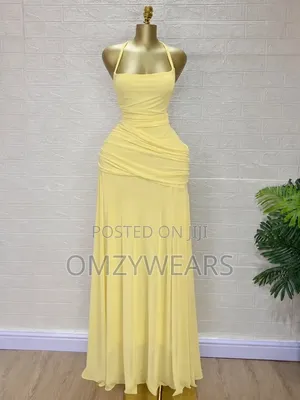 Title: Elegant Yellow Halter Neck Ruched Maxi Dress for Women
.