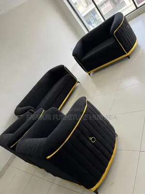 A Complete Set of Black Chair With Golden Pipe