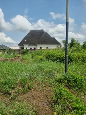 One Plot of Land With Foundation of 5self Contain