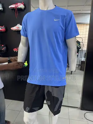 Blue Nike Shirt & Black Camo Shorts