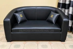 Black Leather Two-Seater Sofa – Fairly Used, Negotiable