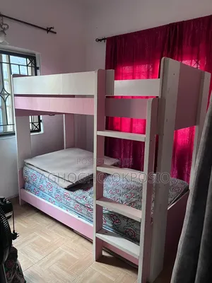 6×3 Pink-and-White Double Bunk Bed Frame With Mattresses.