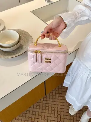 Cute Small Quilted Vanity Handbag With a Gold-Tone Top Handle and Mat
