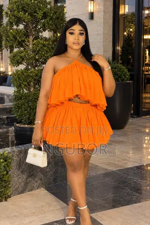 Orange Two-Piece Women’s Outfit – Stylish Flare Top & Mini Skirt