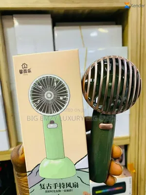 Rechargeable Hand Fan With Stand .