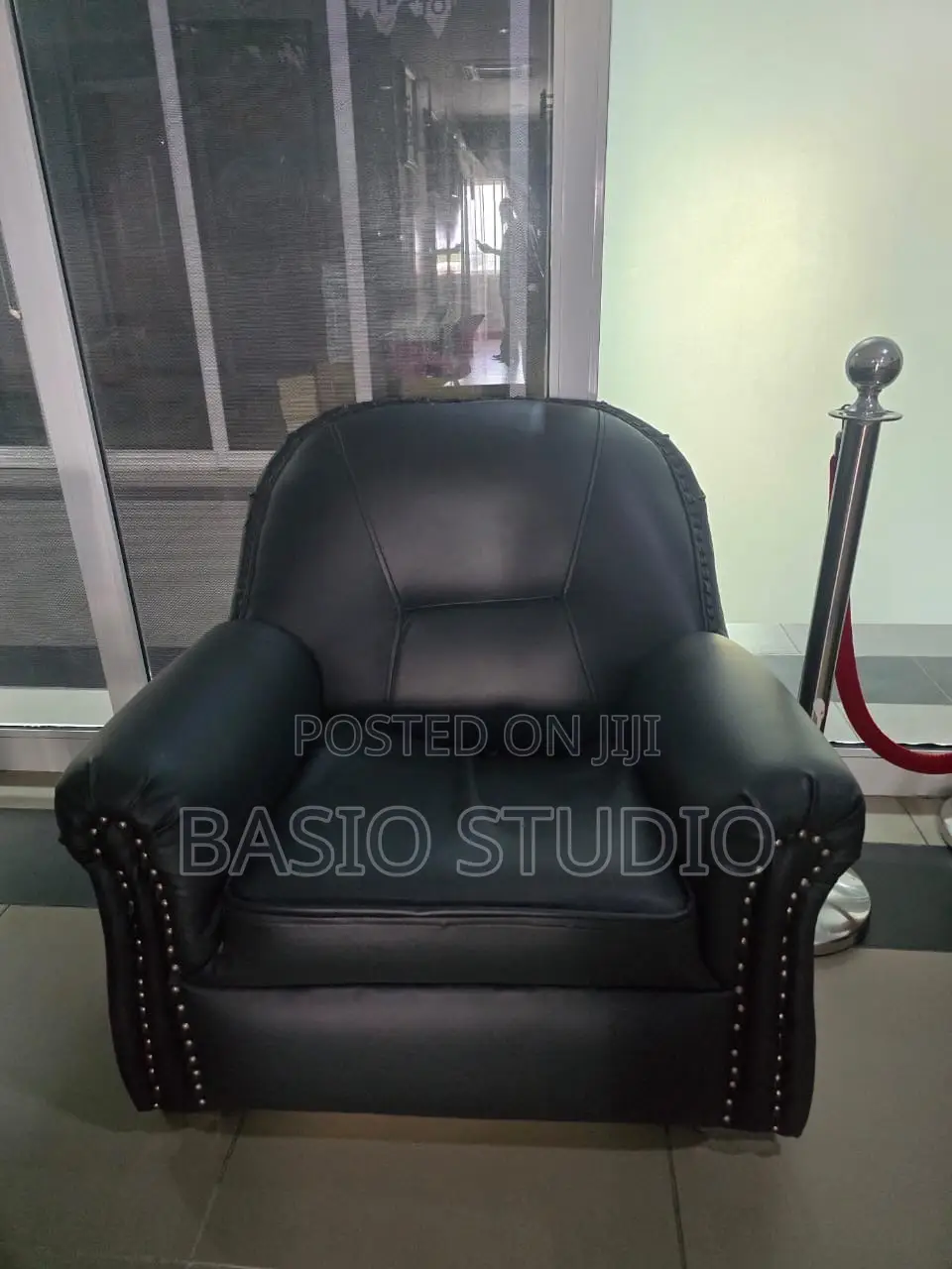 Neatly Used Black Leather Single Seater Sofa