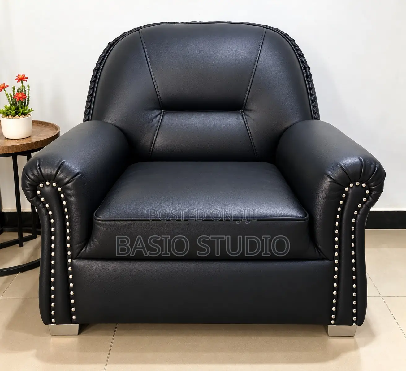 Neatly Used Black Leather Single Seater Sofa
