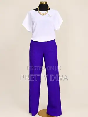 A Beautiful White Top Paired With Our Signature Pants