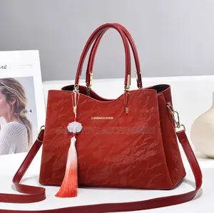 Ladies Crinkled Leather Handbag With Tassel Charm & Strap