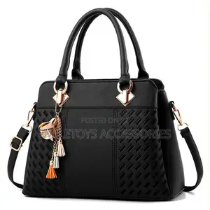 Textured Ladies Handbag With Flower Charm & Strap