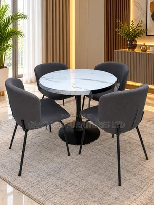 Gold Pedestal Dining Table With Four Curved Fabric Chairs