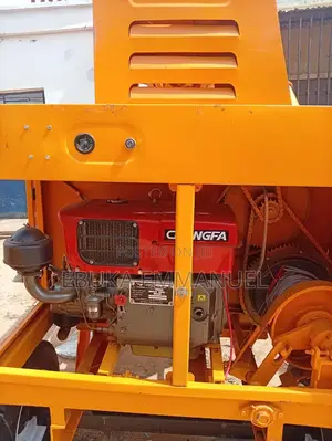 Concrete Mixer With Lifting Hoper