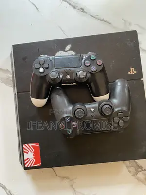 PlayStation 4 With 2 Pads and Available Game