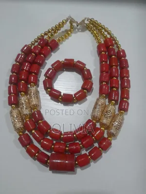 Coral Cultural Beads With Gold Ornaments