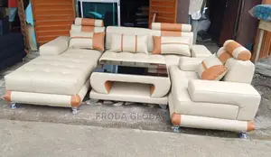L Shaped Sofa With Single a Sitter Chair and Table